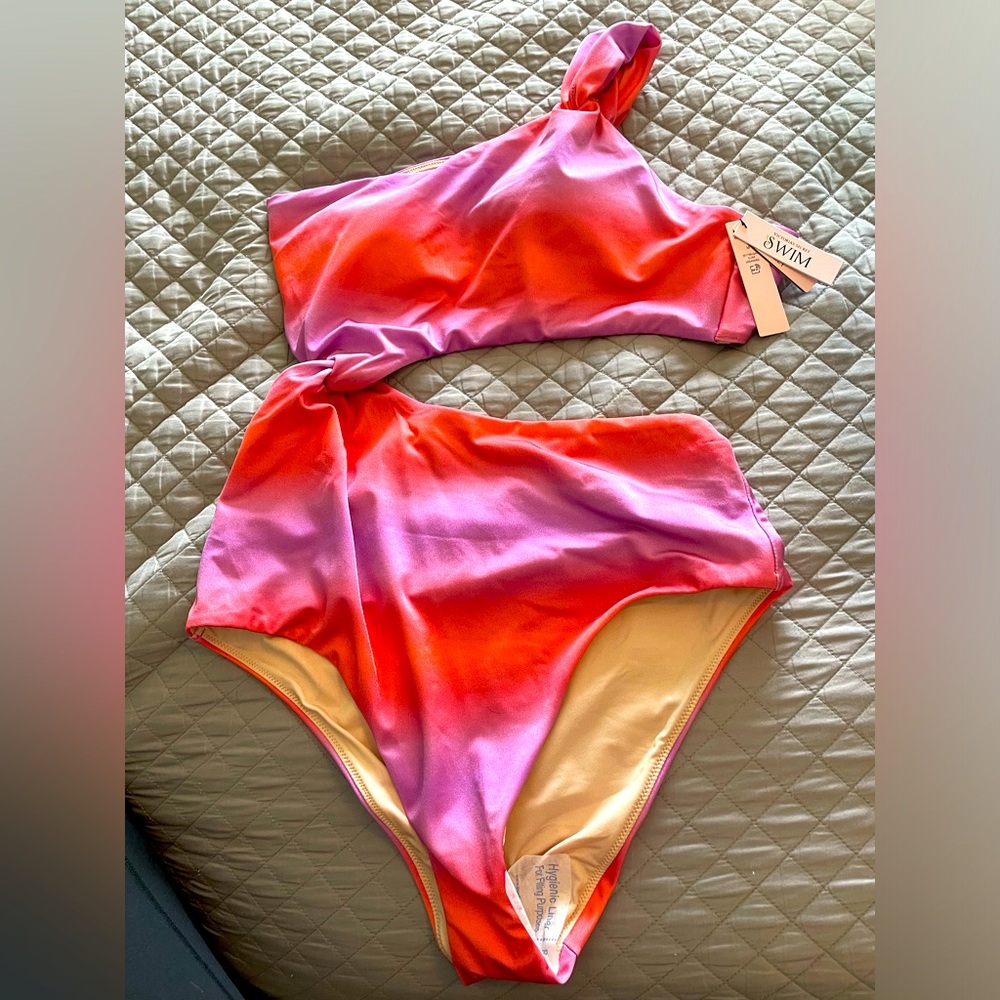 Multi colored brand new never worn VS women’s swimsuit.